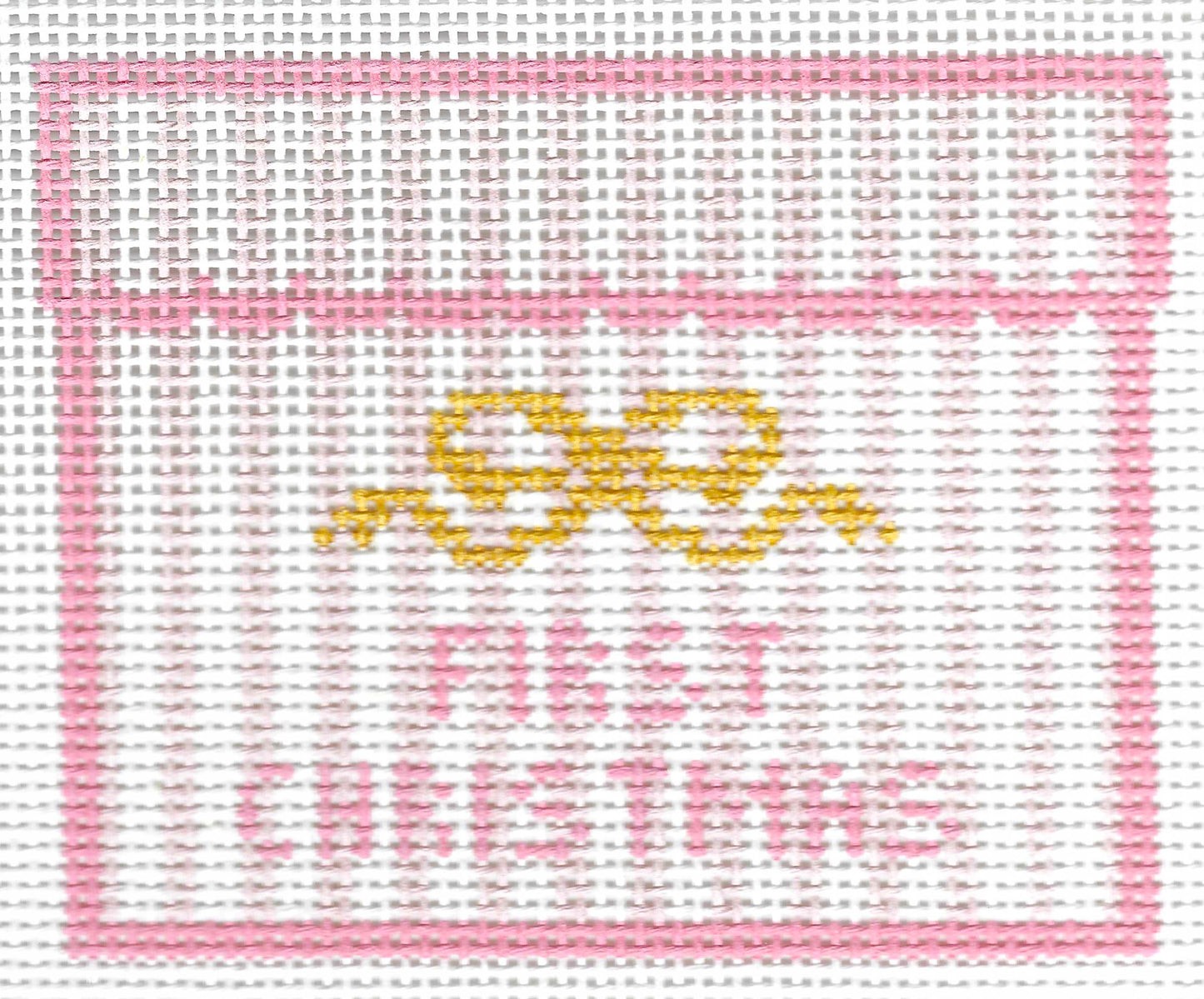 SLS Needlepoint canvas design featuring a pink border, a yellow bow motif, and the words 'FIRST CHRISTMAS' in pink on a white background.