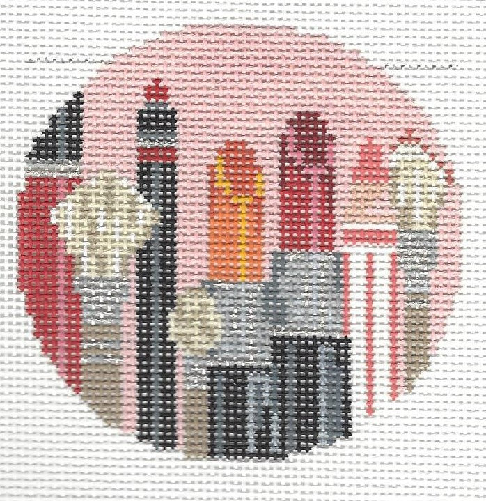 Kelly Clark round needlepoint canvas of colorful makeup tools with light pink background and fire red lip palette