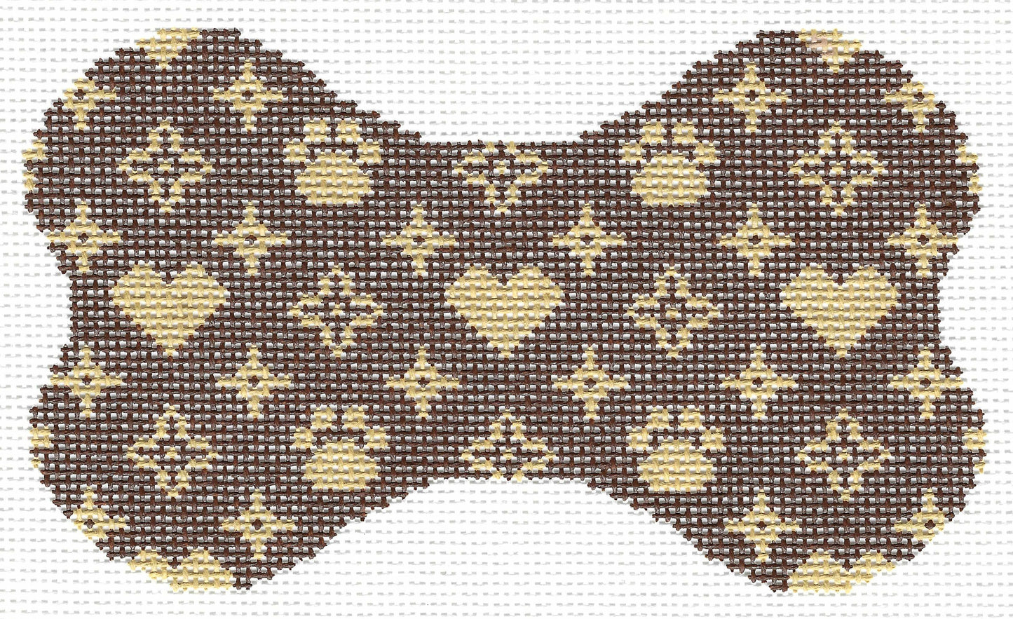 Lauren Bloch Designs bone-shaped needlepoint canvas with a repeating pattern of beige hearts, paw prints, and diamond motifs on a dark brown background.