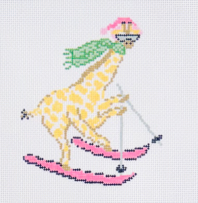KCN Designers needlepoint canvas of la dolce vita alpine giraffe skiing with pink skis, green scarf, and sunglasses
