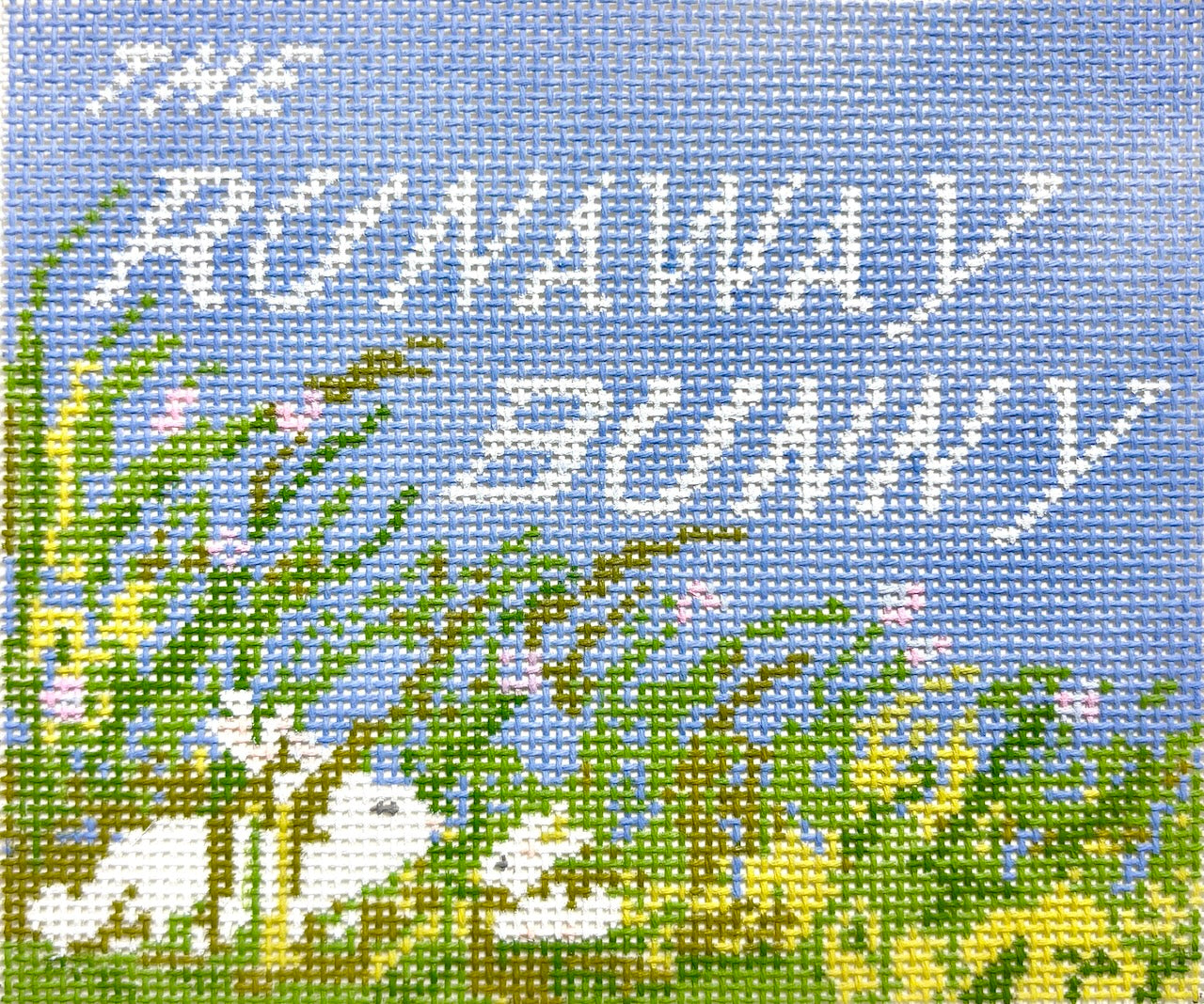Jessica Tongel Designs needlepoint canvas of 'The Runaway Bunny' text with a blue background, greenery, and two bunnies.