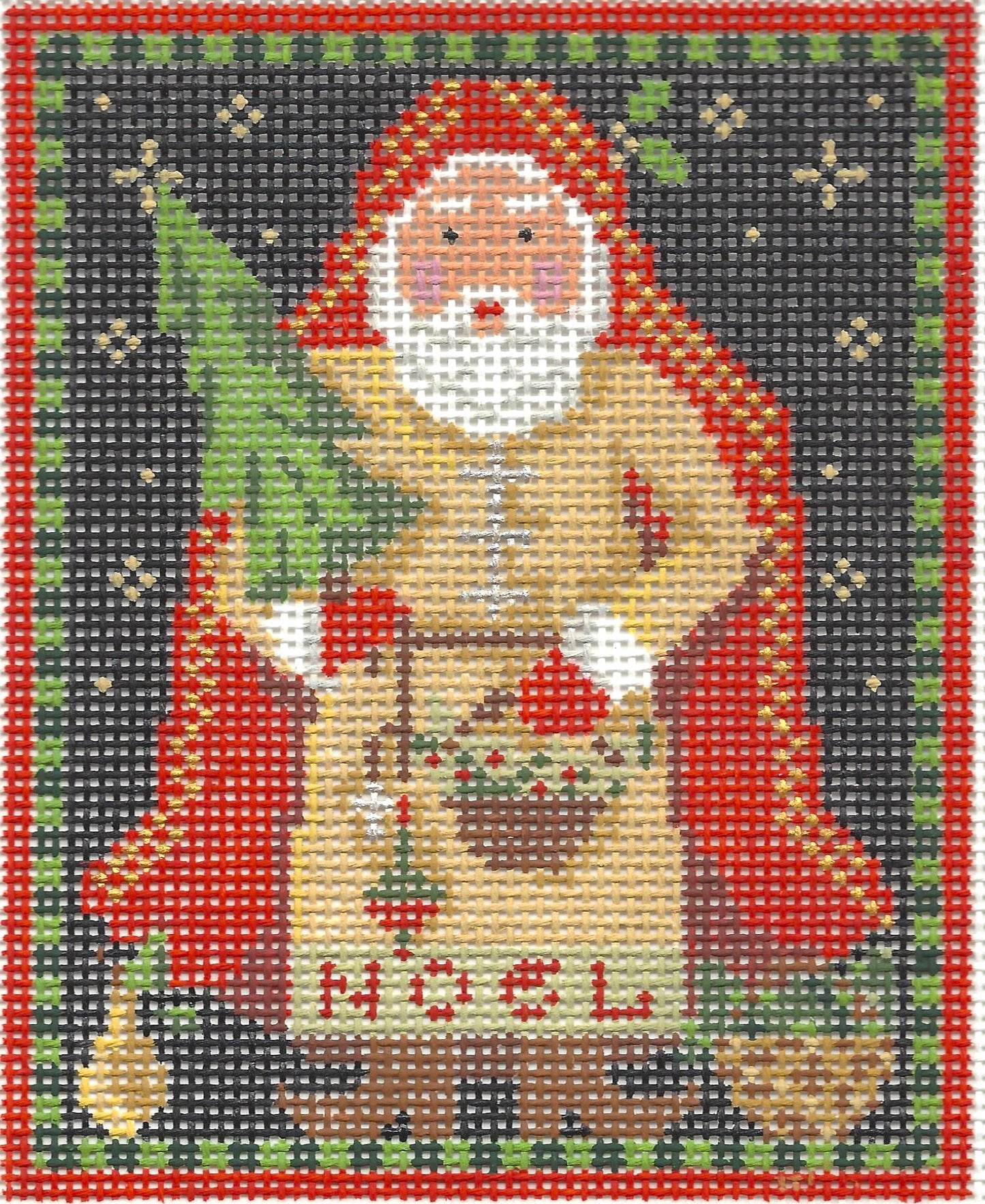 Kelly Clark needlepoint canvas of a nordic noel Santa holding a small Christmas tree with text 'NOEL' on clothes and a red cape