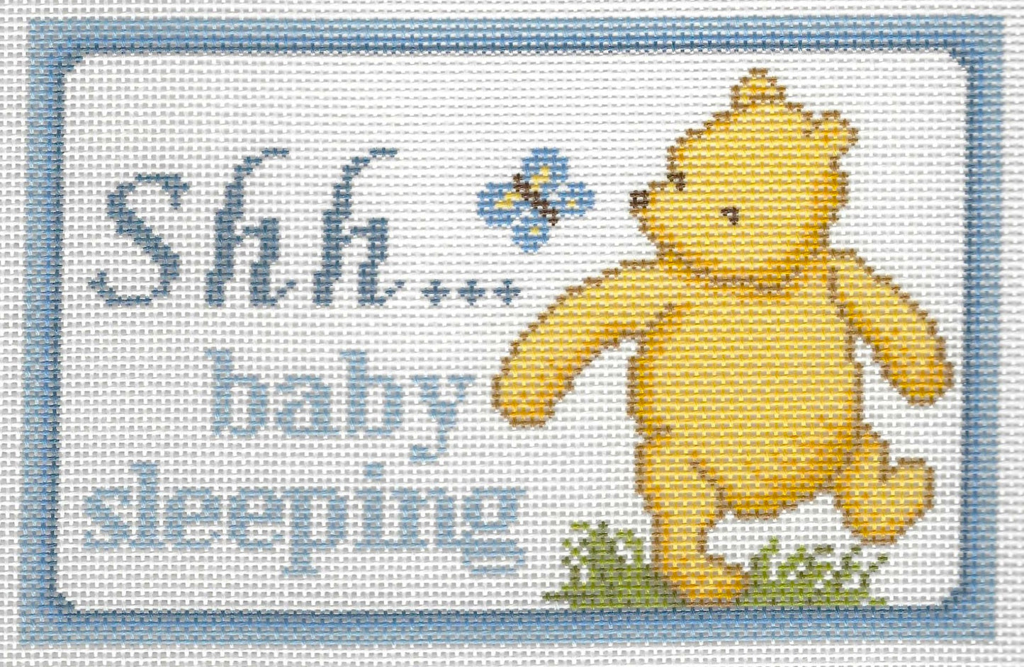 Needlepaint needlepoint canvas of Pooh and a butterfly with 'Shh... baby sleeping' text on a white background with light blue border