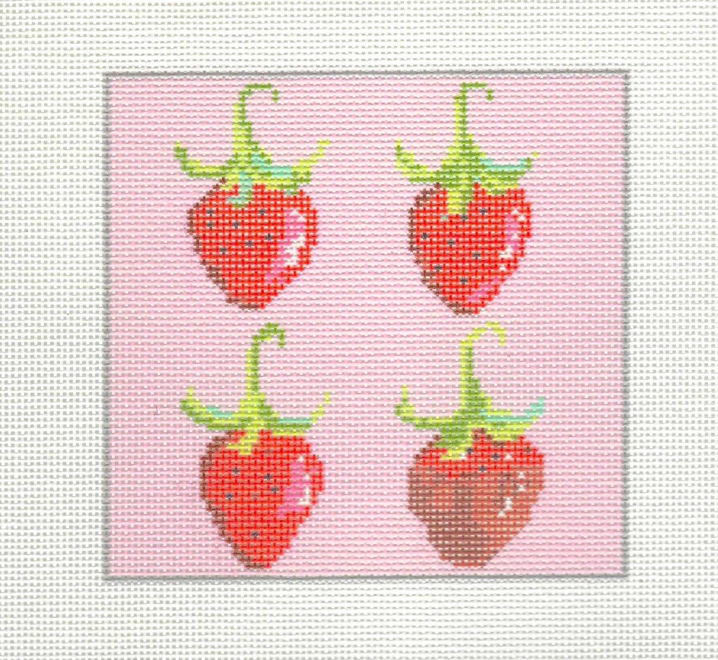 KCN Designers needlepoint canvas of four strawberries on a pink background