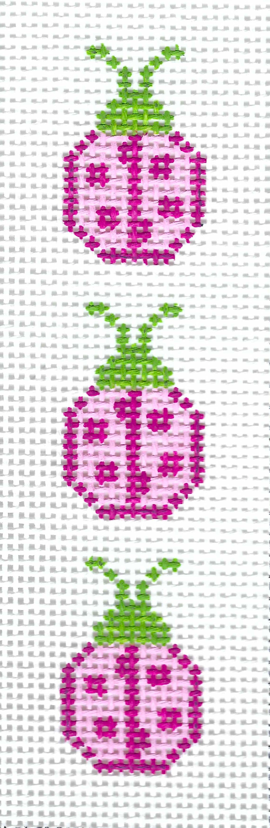 j. childs needlepoint canvas of three vertical ladybugs on a white background, each with green antennae and pink/magenta bodies.