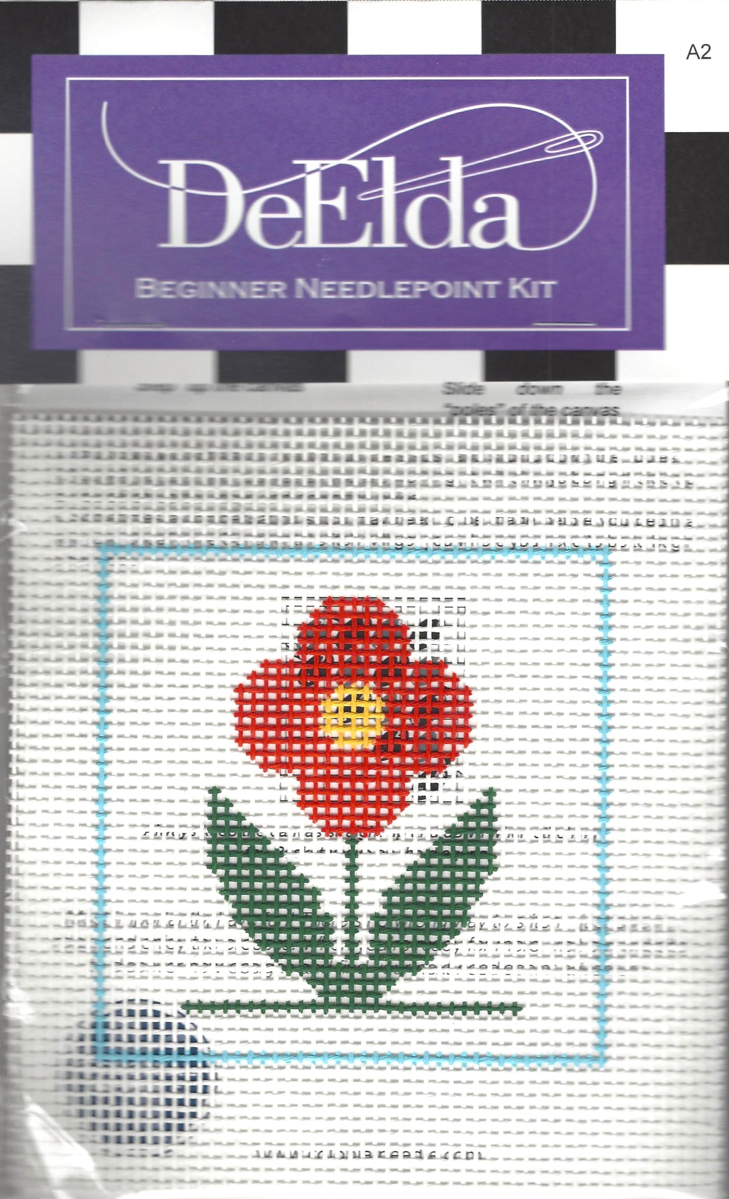 DeElda beginner needlepoint kit with a red flower design on a white background