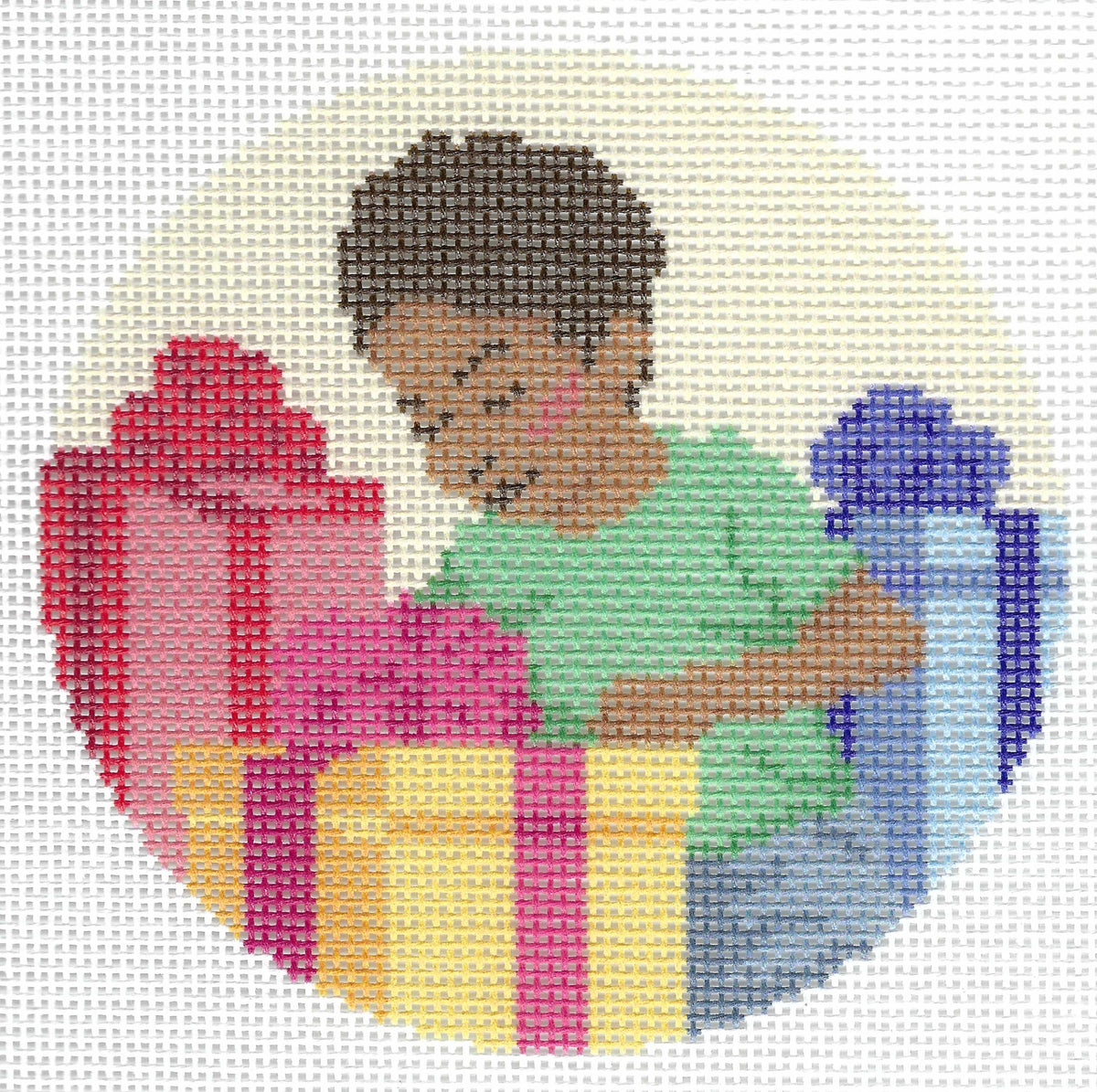 Spellbound Stitchery circular needlepoint canvas featuring an illustration of a child with dark hair in a green shirt opening colorful gift boxes in red, yellow, and blue.
