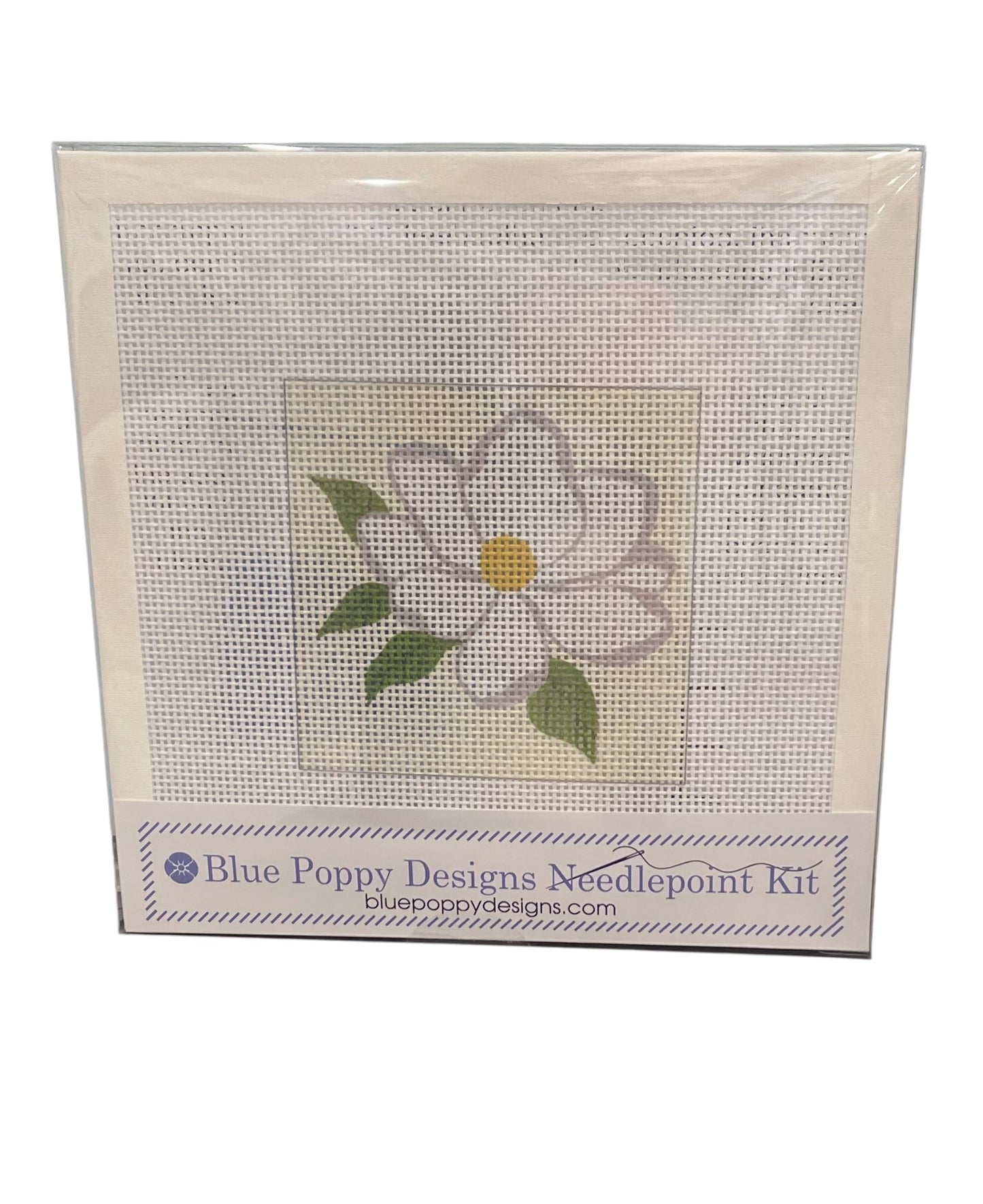 Blue Poppy Designs needlepoint kit with a white magnolia design on a white background