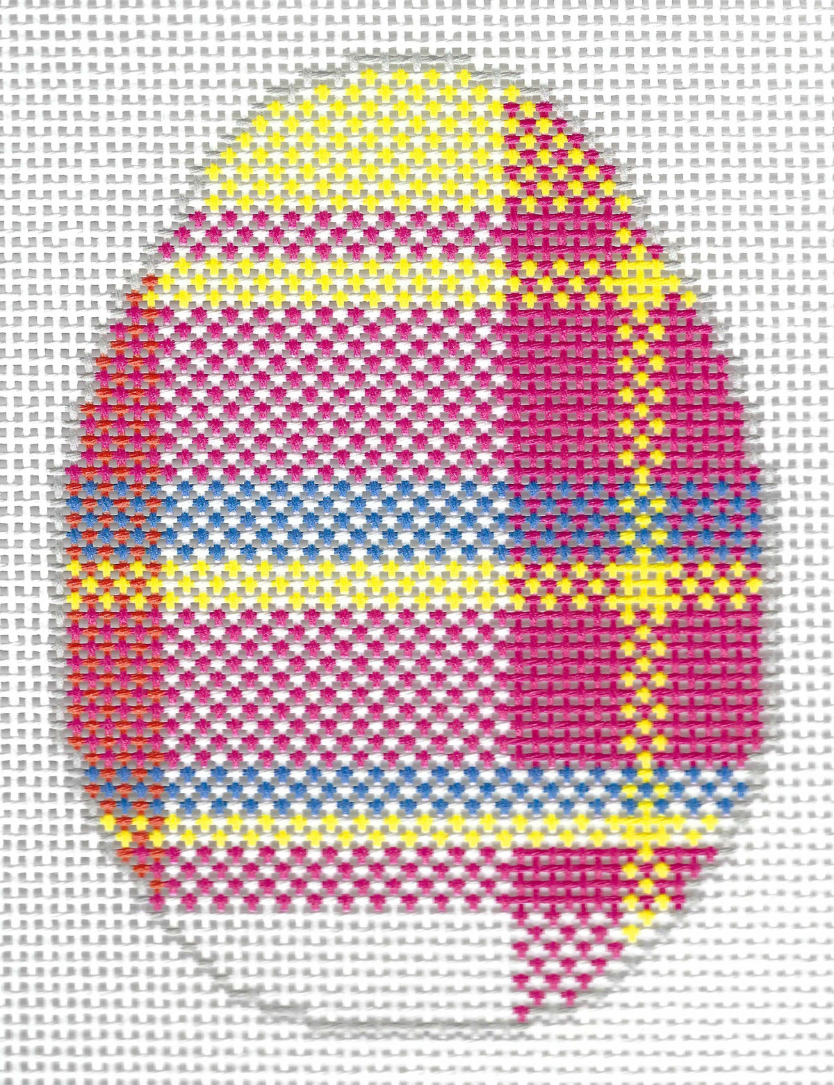 Elizabeth Brooke needlepoint canvas of an egg with a colorful plaid design featuring pink, yellow, blue, and red sections.