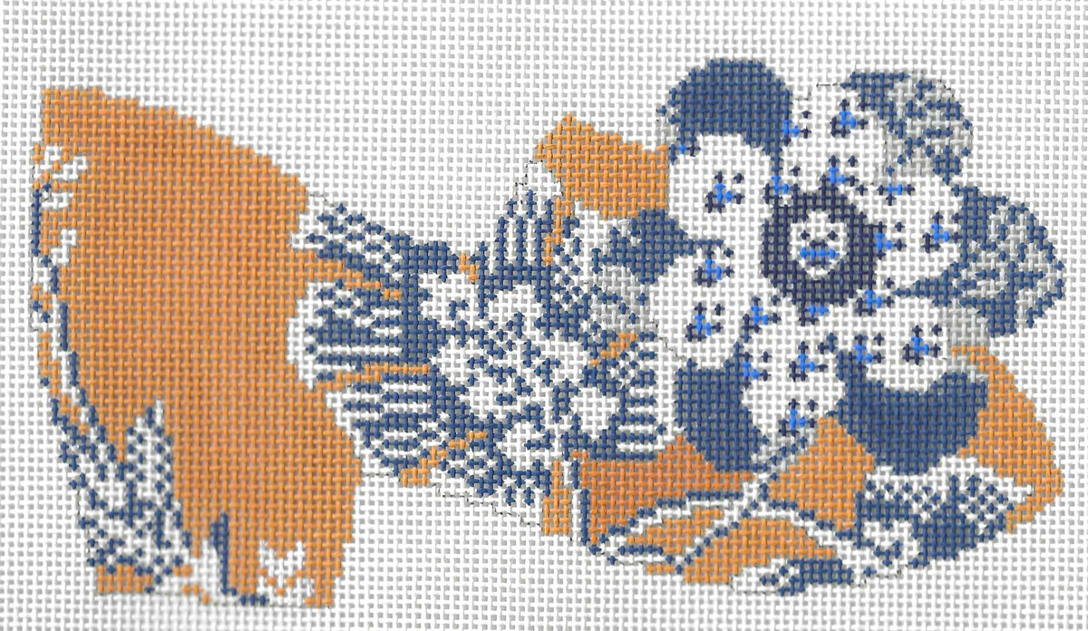 Cooper Oaks needlepoint canvas of a gold shoe with blue and white floral designs.