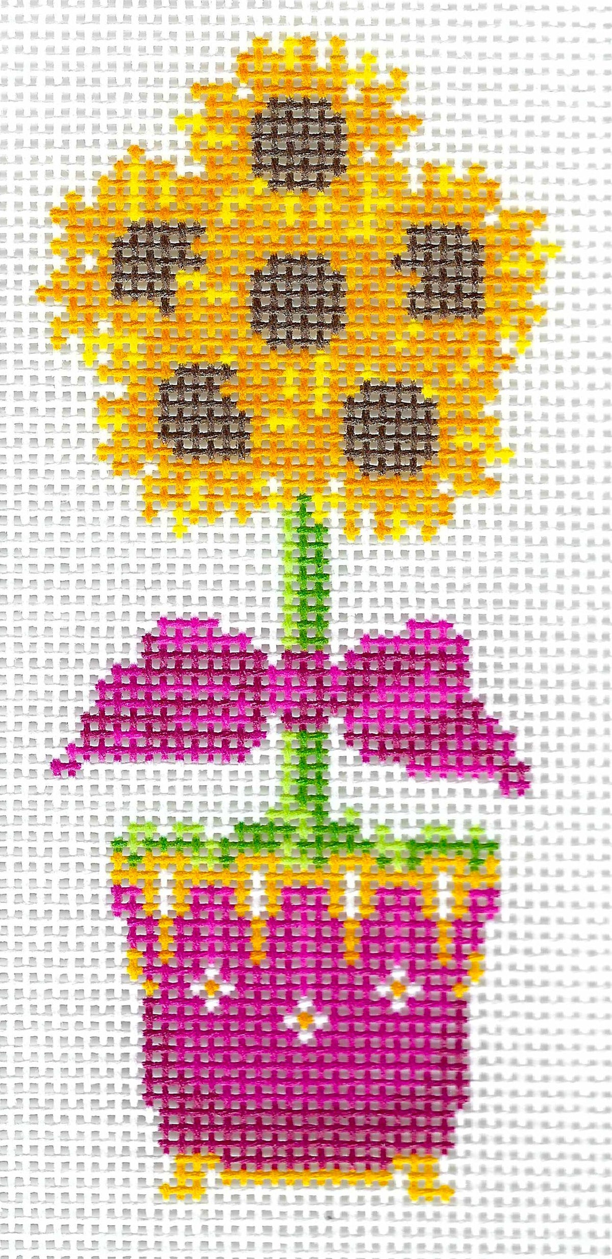 Wipstitch needlepoint canvas of a sunflower topiary in a pink pot, shown on a white background.