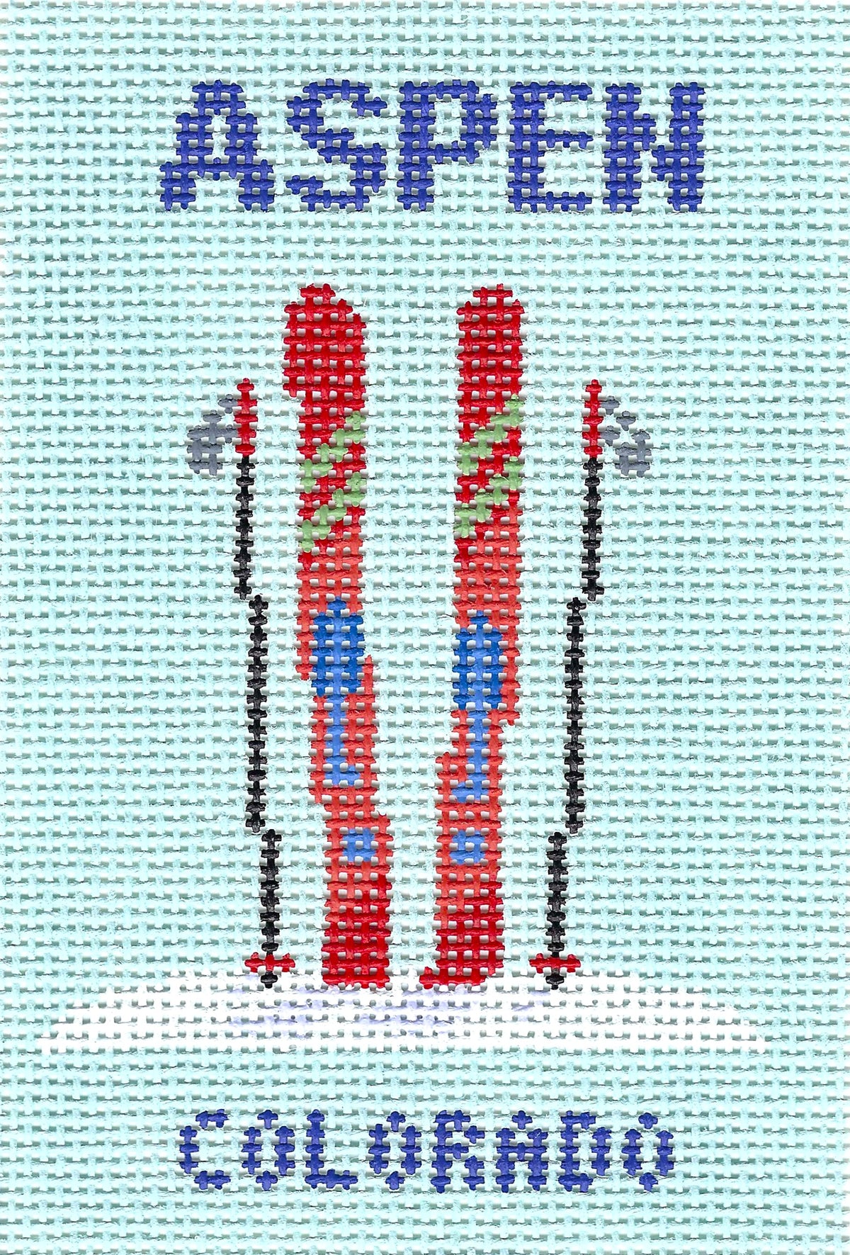 Atlantic Blue Canvas square needlepoint canvas featuring a light blue background with the word 'ASPEN' in blue at the top, two red skis in the center, ski poles, and 'COLORADO' in blue at the bottom.