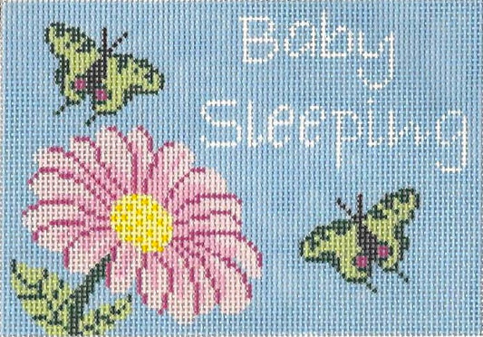 j. childs needlepoint canvas of design with butterflies and a pink flower on a blue background with text 'Baby Sleeping'