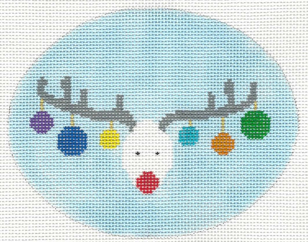 Burnett & Bradley needlepoint canvas of reindeer face with colorful ornaments on antlers with a light blue background