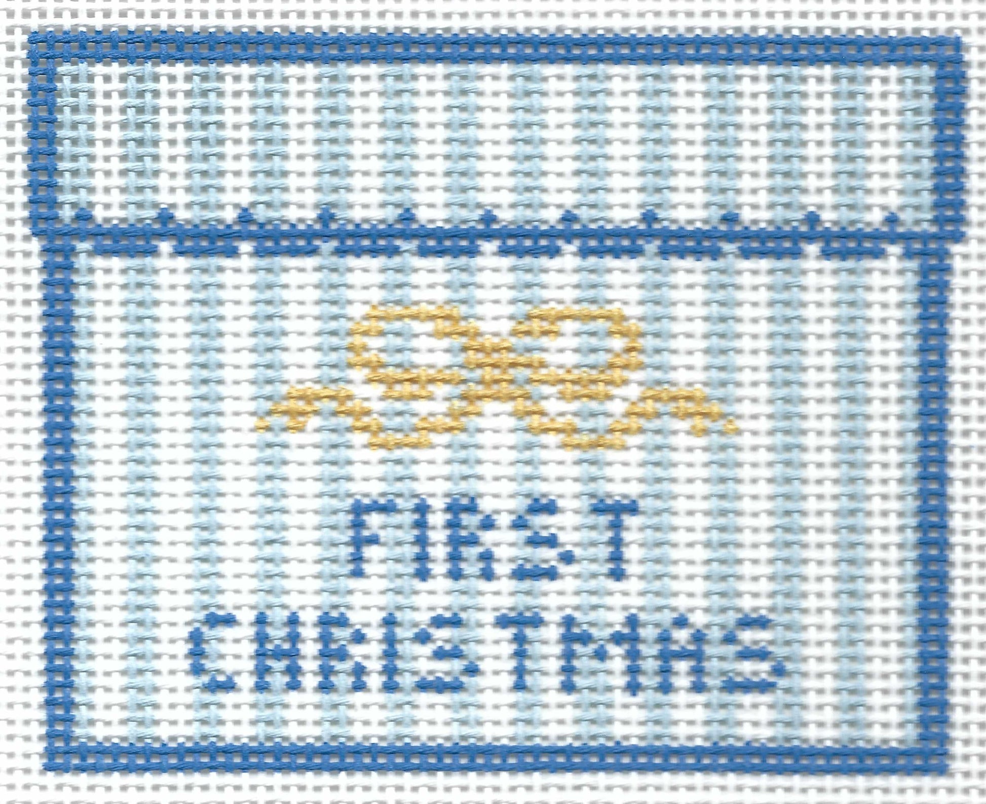 SLS Needlepoint canvas design featuring a blue border, a yellow bow motif, and the words 'FIRST CHRISTMAS' in blue on a white background.