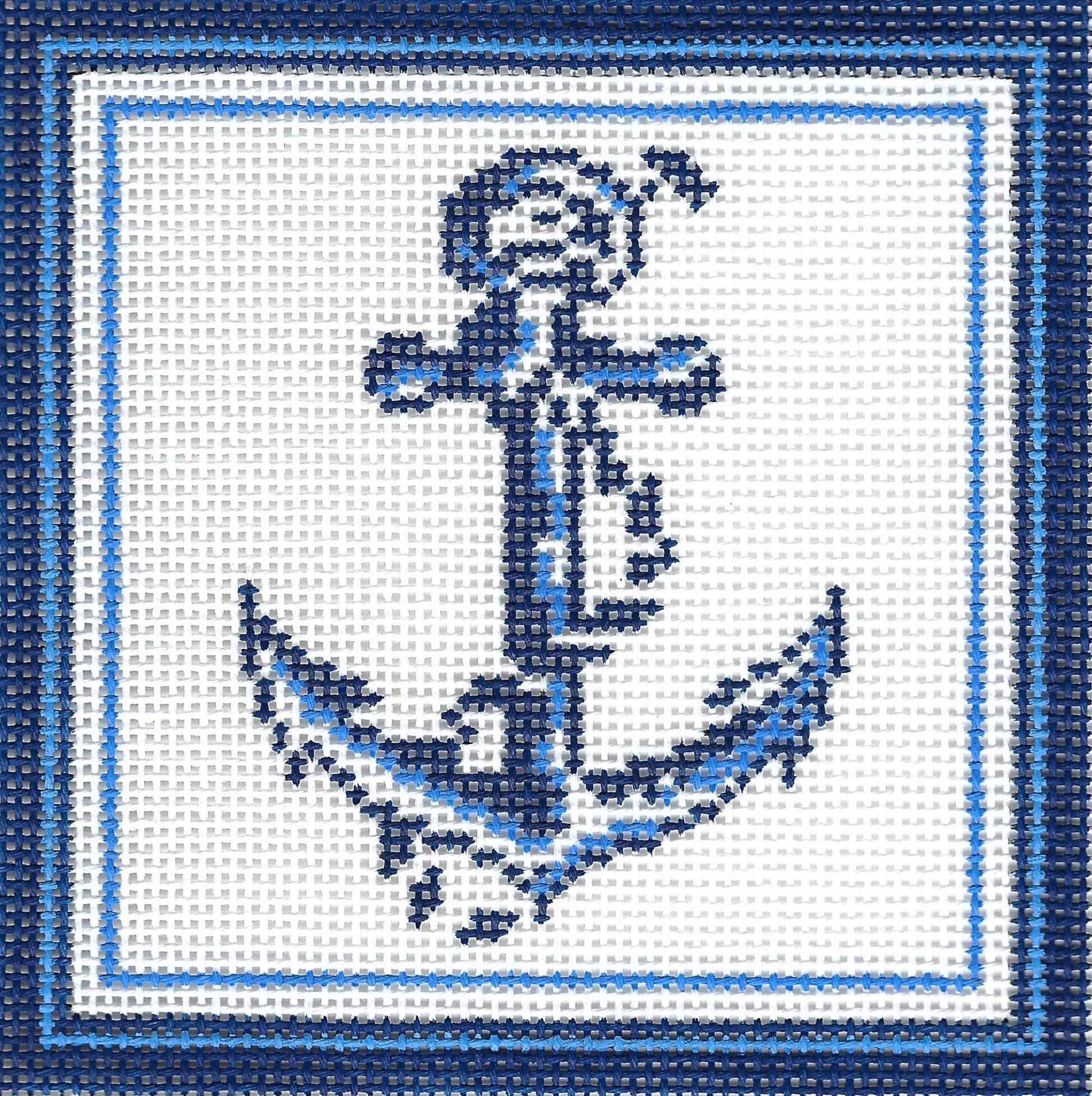 Kirk & Bradley square needlepoint canvas featuring a navy blue anchor design on a white grid background, framed by a blue border.
