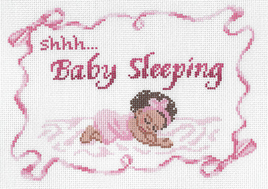 Spellbound Stitchery needlepoint canvas featuring a small baby girl sleeping with pink text 'shhh...Baby Sleeping" and a squiggly pink border with bows.