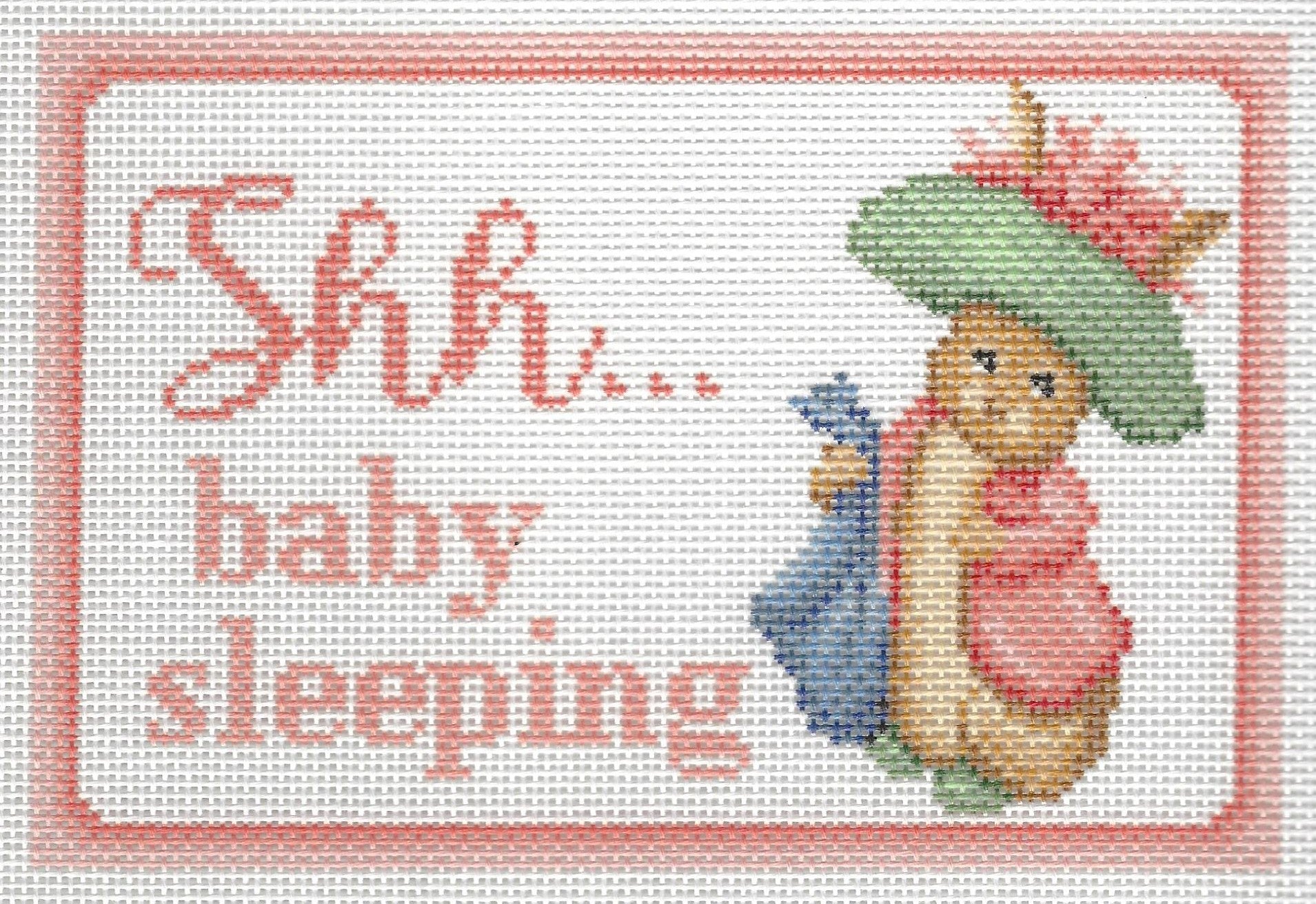 Needlepaint needlepoint canvas of Benjamin Bunny with 'Shh... baby sleeping' text on a white background with light pink border