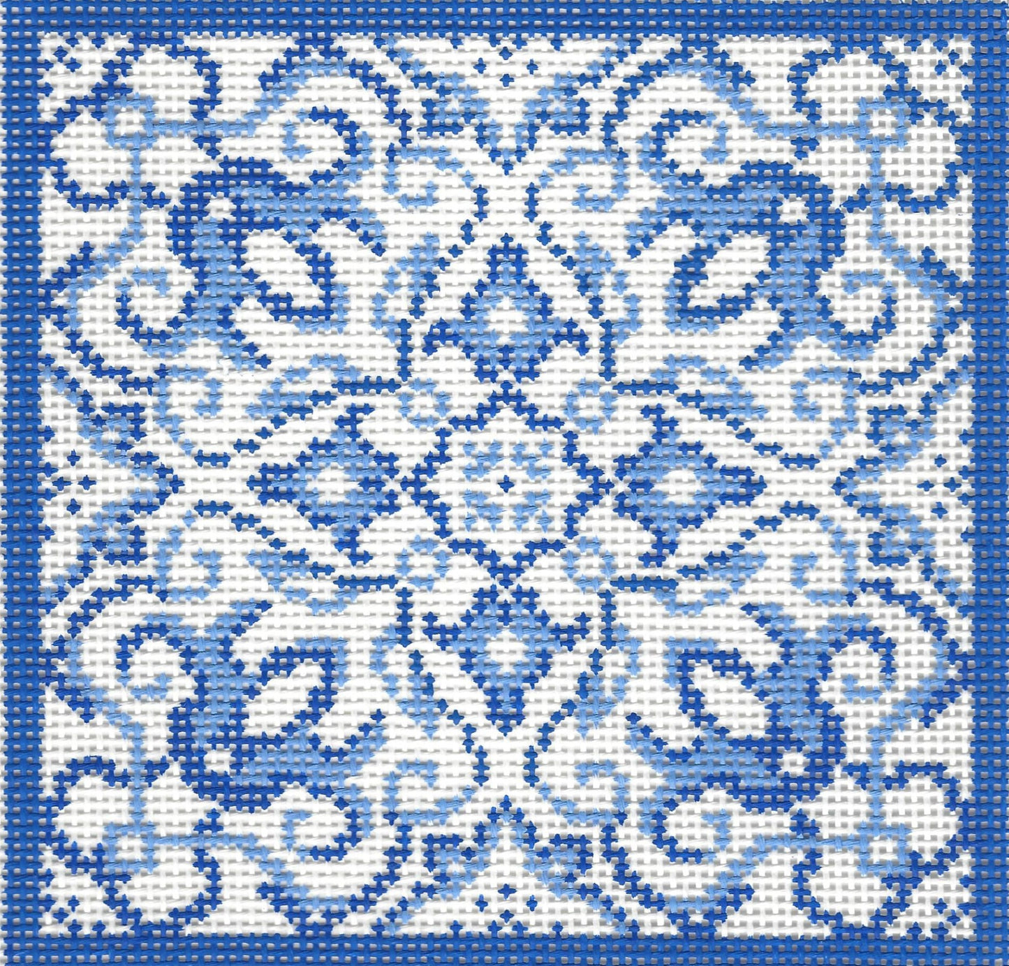 Treglown needlepoint canvas of blue and white geometric pattern with a blue border