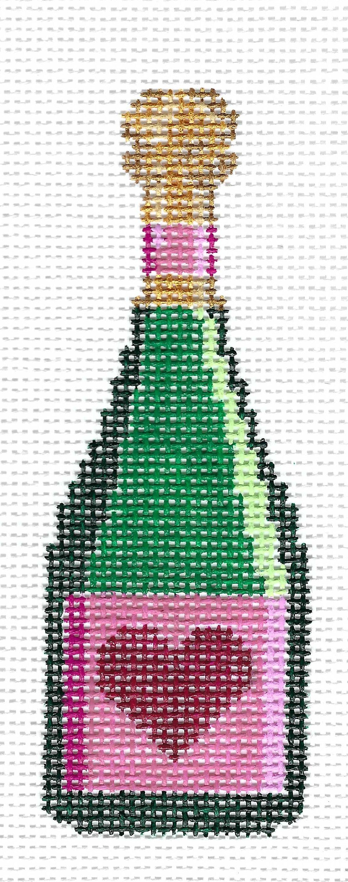 k.ndlpt needlepoint canvas of a champagne bottle with a green body, pink label with a dark pink heart, and a gold cork on a white background.