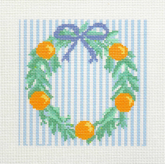 KCN Designers needlepoint canvas of green wreath with oranges on a blue and white striped background