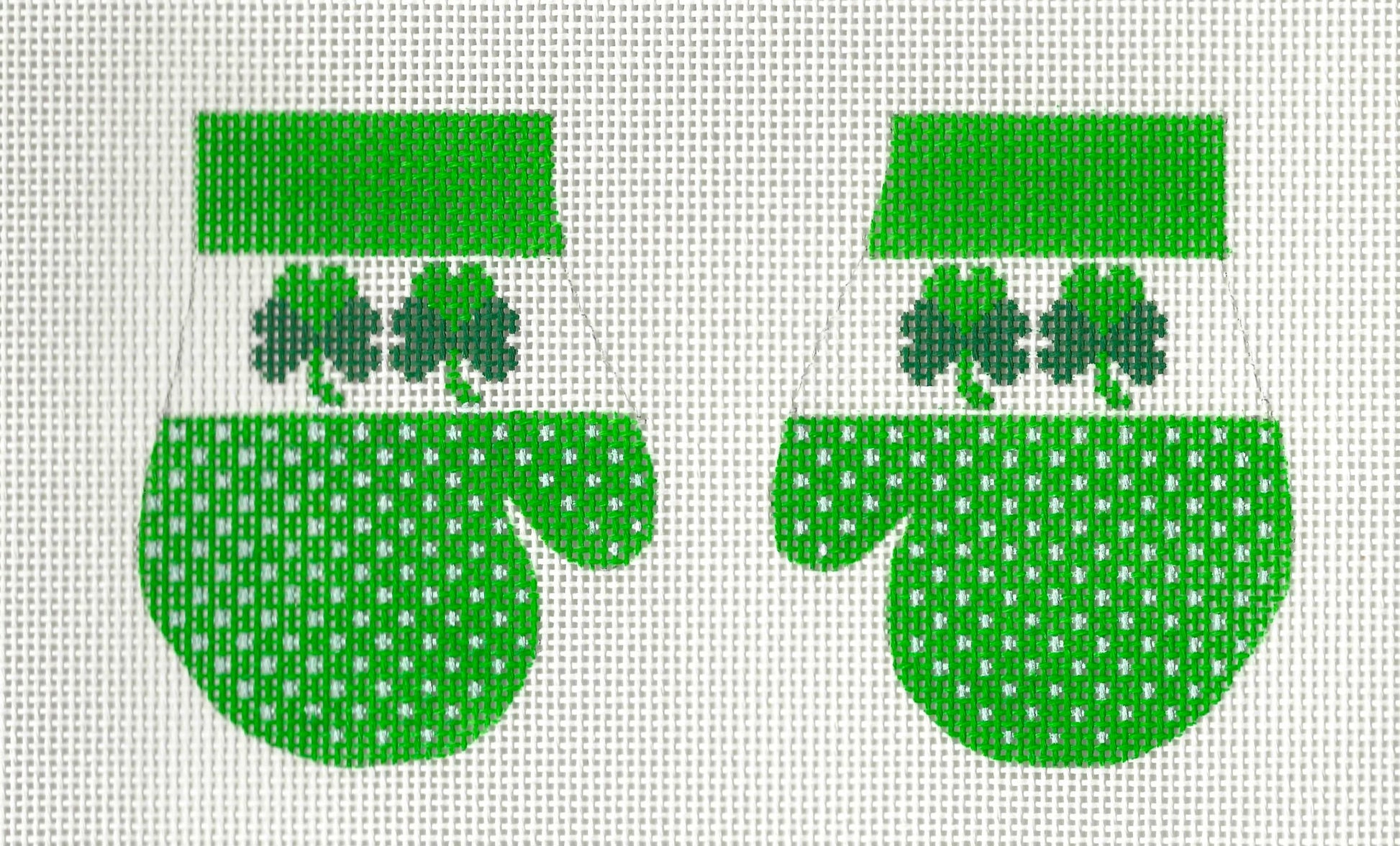 KCN Designers needlepoint canvas of green mittens with clover designs