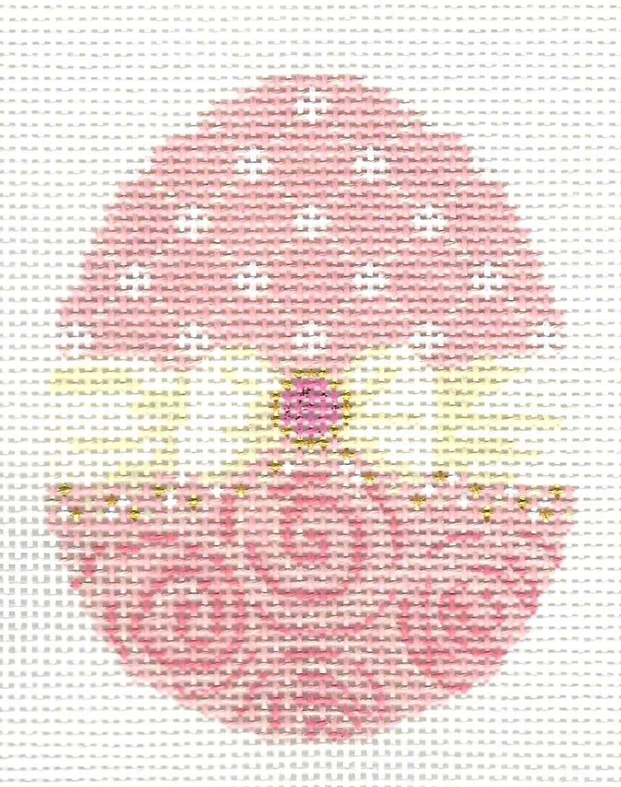 Kelly Clark needlepoint canvas of egg with  different patterns on the top and bottom with a cream-colored bow in the middle