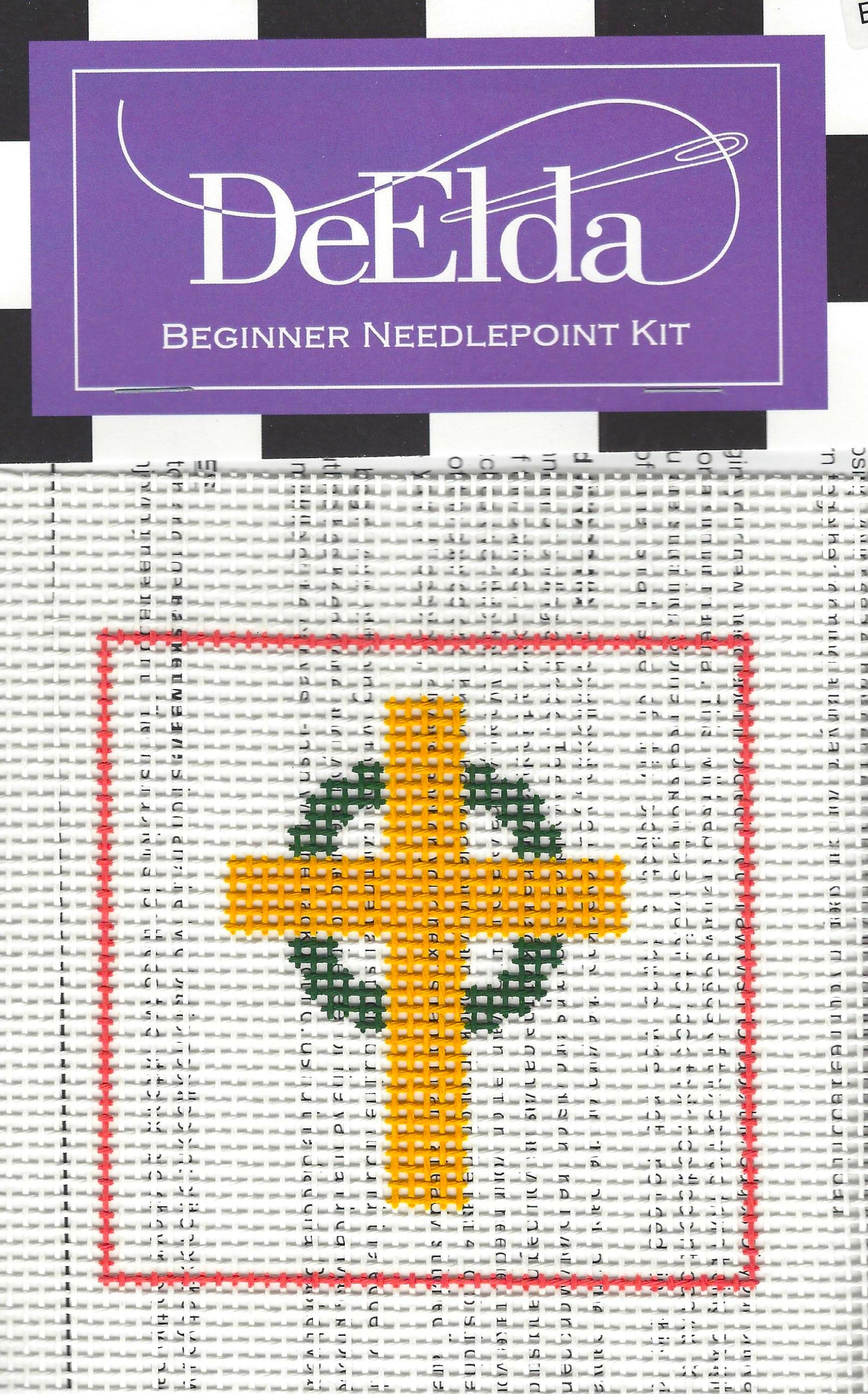 DeElda beginner needlepoint kit with a cross design on a white background