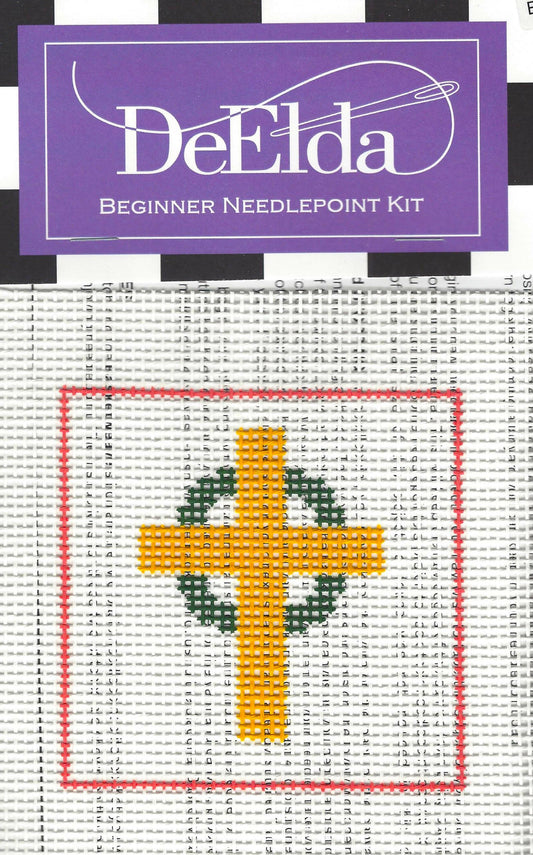 DeElda beginner needlepoint kit with a cross design on a white background