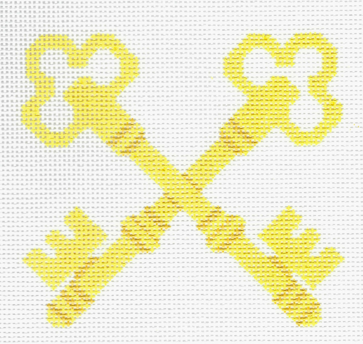 Prepsetter needlepoint canvas of yellow crossed-key design on a white background.