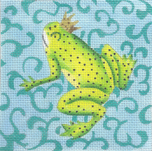 Colors of Praise needlepoint canvas of a green frog with a crown on a blue patterned background