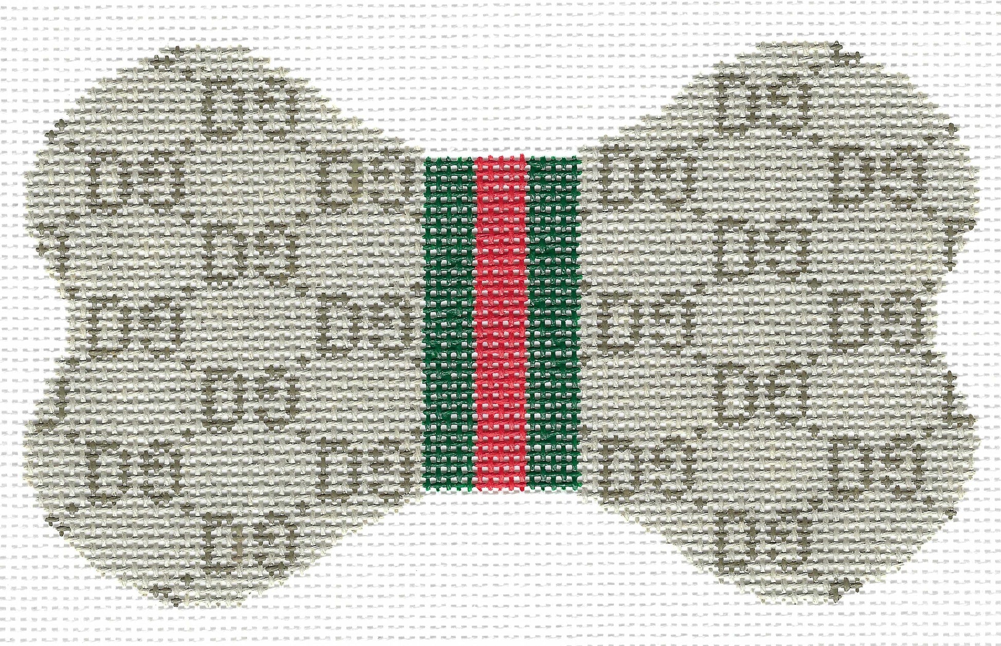 Lauren Bloch dog bone-shaped needlepoint canvas featuring a GG monogram pattern in beige and brown on a white background, with a central green and red web stripe.
