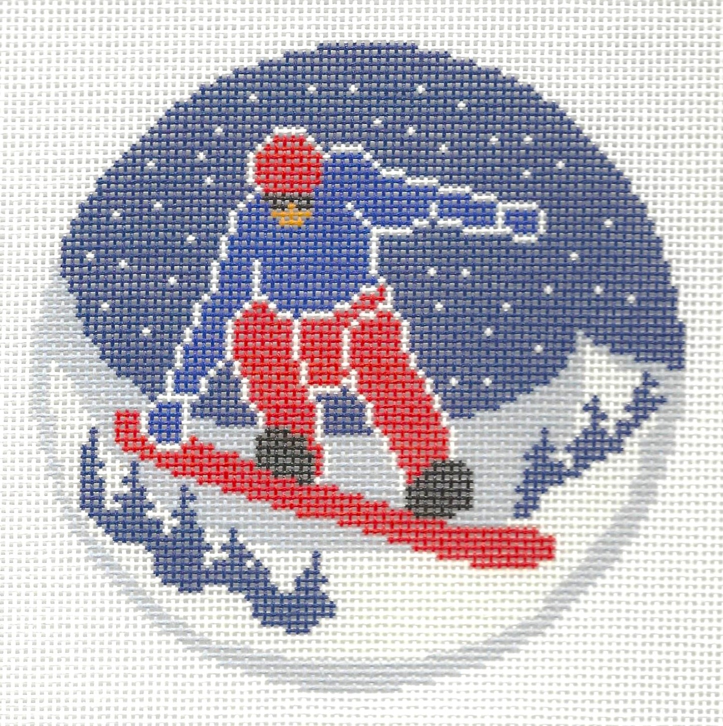 Needlepaint round needlepoint canvas of of a snowboarder with a snowy background