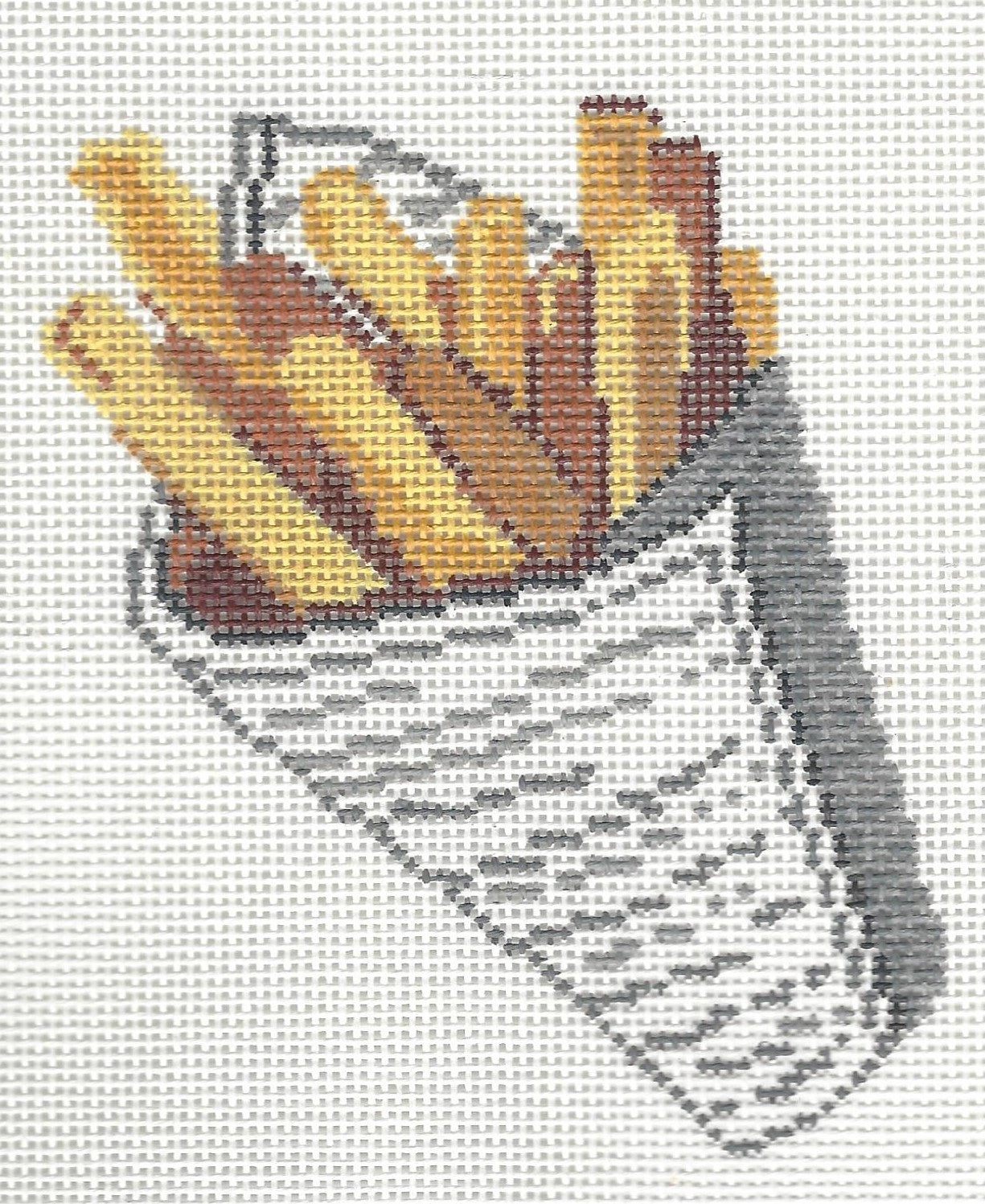 Stitch Style needlepoint canvas of French fries in a newspaper cone on a white background