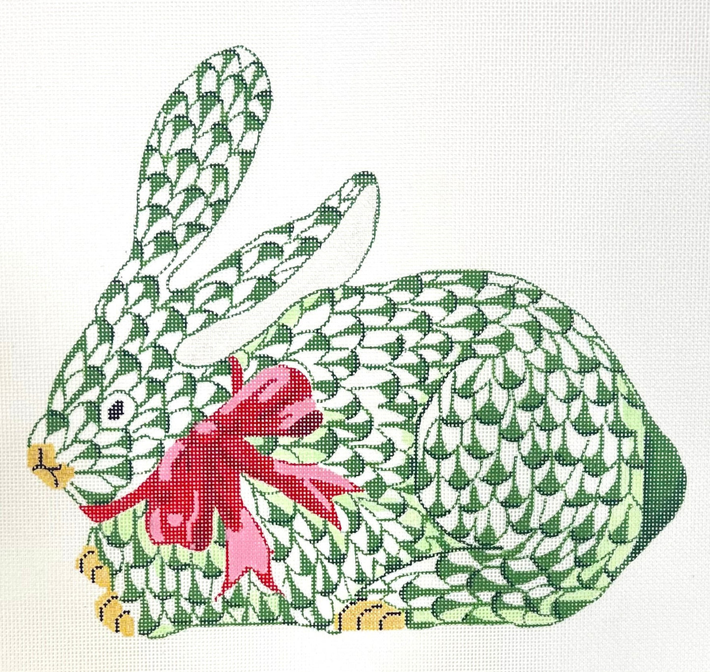 Village Needleworks needlepoing canvas of Herend-inspired fishnet crouching bunny - emerald w/ red bow