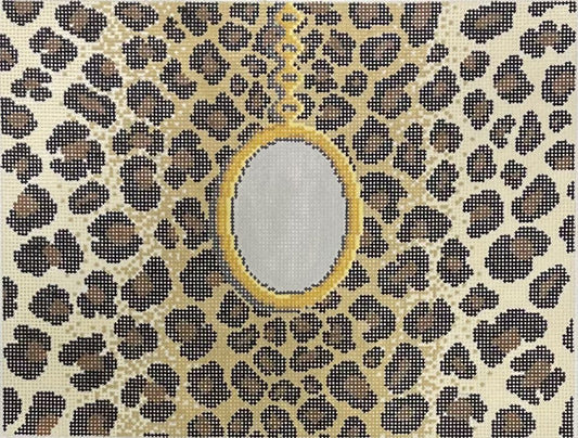 Jeni Sandberg needlepoint canvas of clutch with gold pendant on a leopard print background