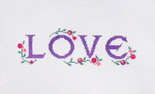 KCN Designers needlepoint canvas of the word 'LOVE' and floral decorations on a white background