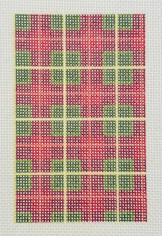 Tilli Tomas Planet Earth needlepoint canvas of design with grid pattern with red, green, and yellow squares
