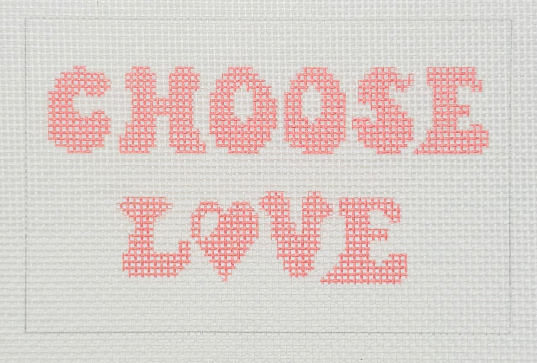 Tilli Tomas Planet Earth needlepoint canvas of text 'CHOOSE LOVE' in pink on a white background