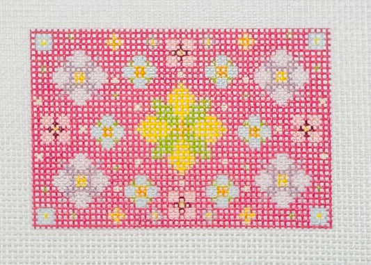 Tilli Tomas Planet Earth needlepoint canvas of floral mandala pattern on a pink background