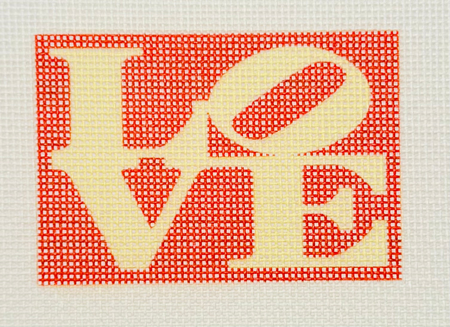 Tilli Tomas Planet Earth needlepoint canvas of the word 'LOVE' with a red background
