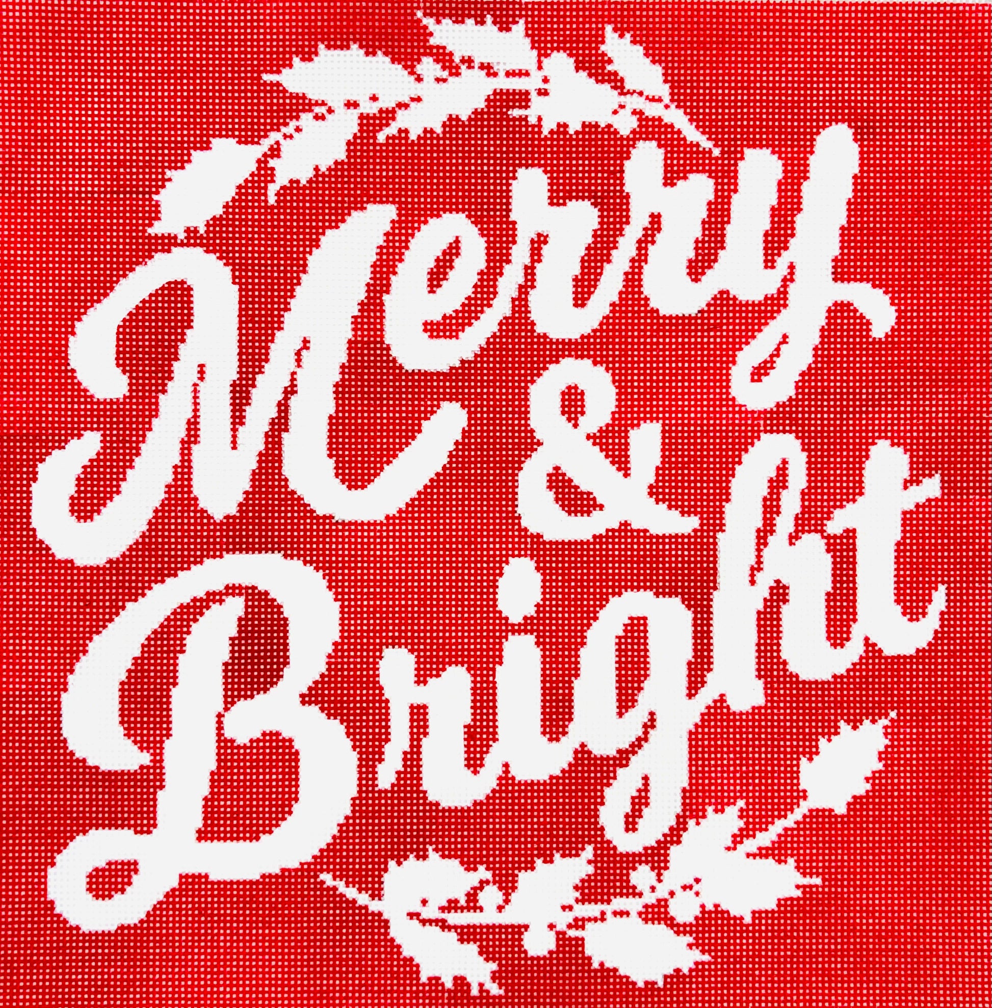 A Stitch in Time needlepoint canvas of white text 'Merry & Bright' on a red background with decorative elements