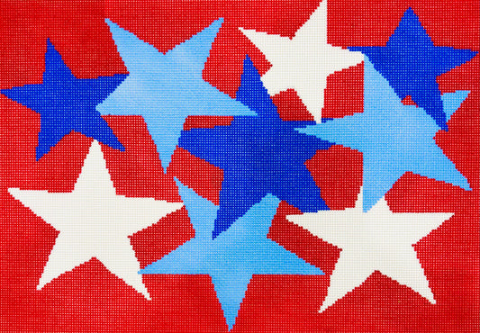 A Stitch in Time needlepoint canvas of white and light and dark blue stars on a red background