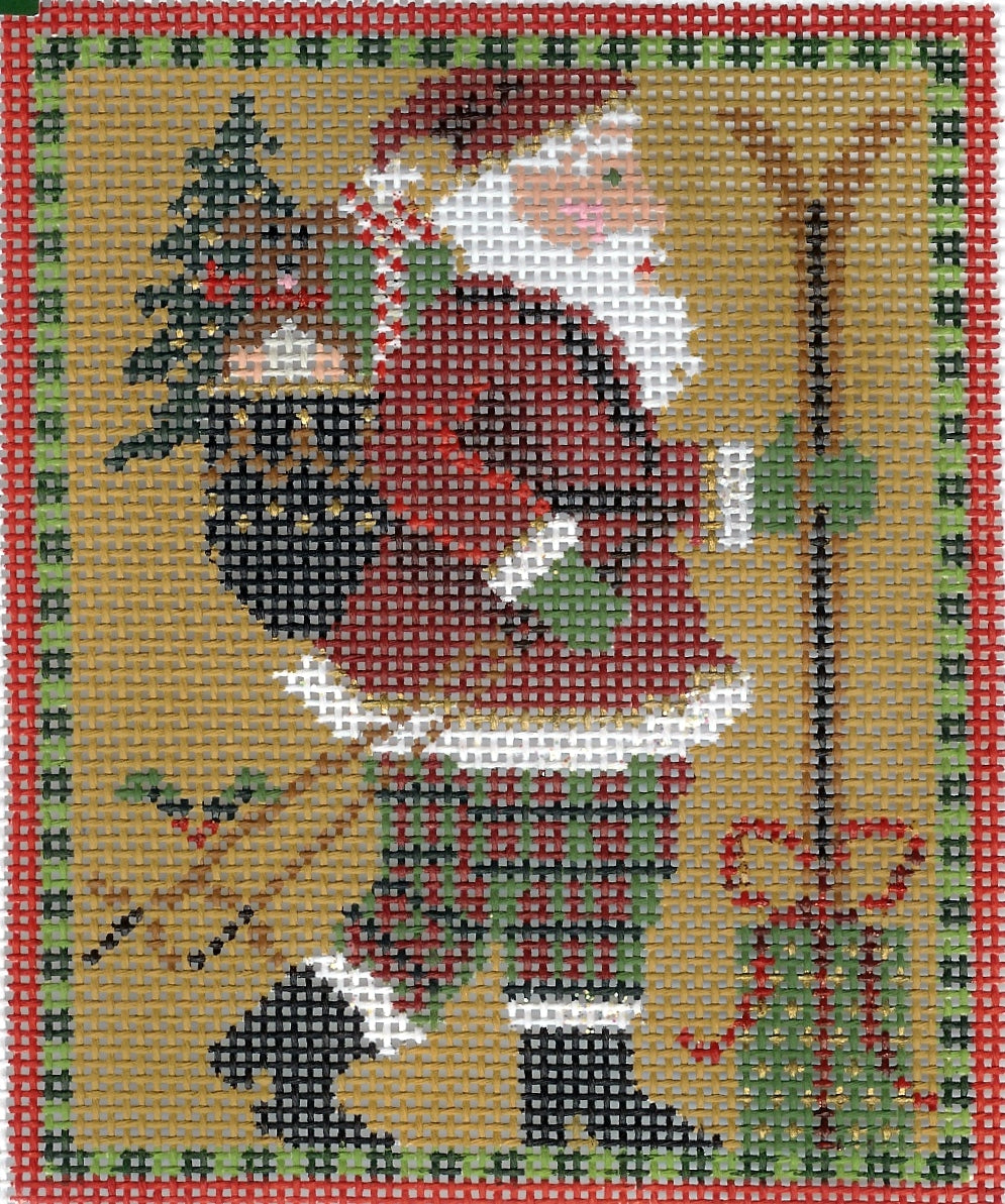 Kelly Clark needlepoint canvas with Santa Claus, skis, a bag of toys with a decorative red and green border