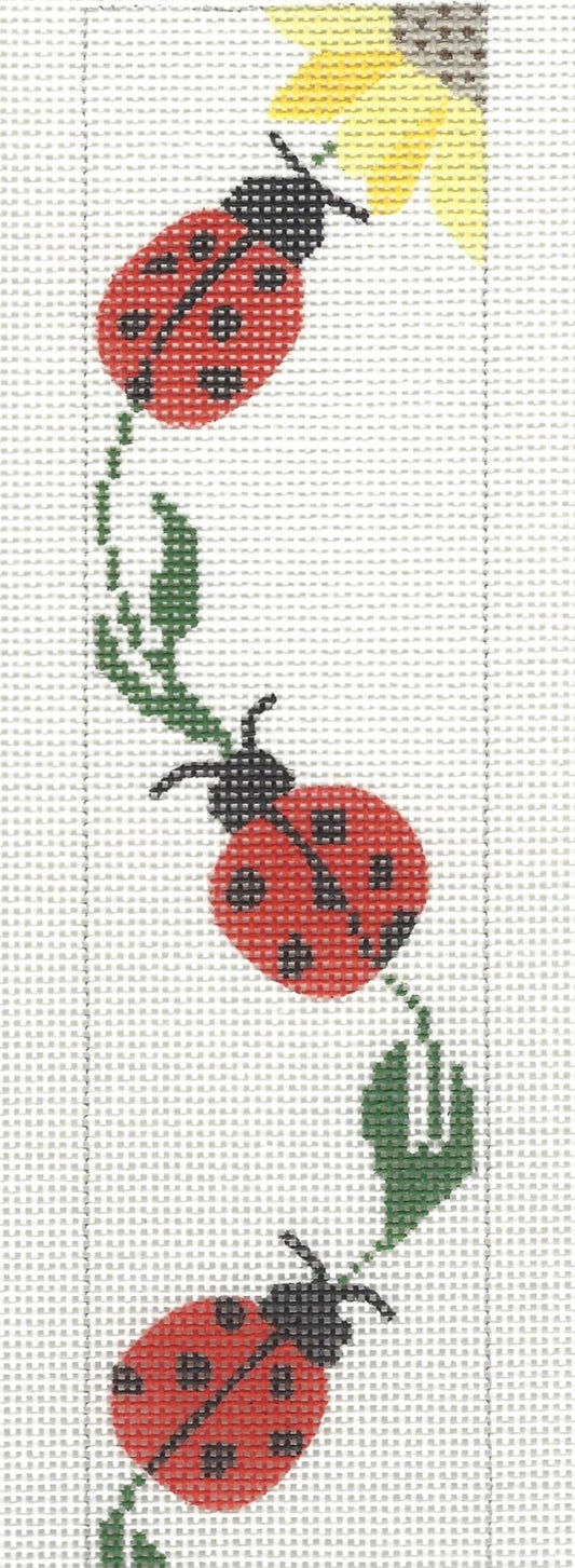 j. childs bookmark needlepoint canvas of three ladybugs and the corner of a sunflower on a white background