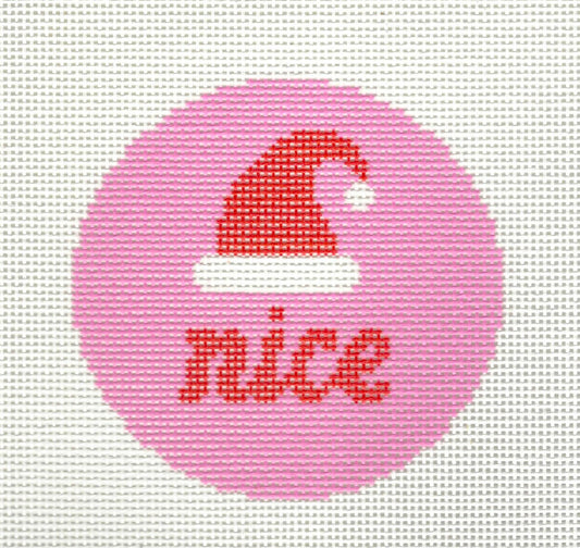 KCN Designers round ornament needlepoint canvas of red Santa hat and 'nice' red text on pink background