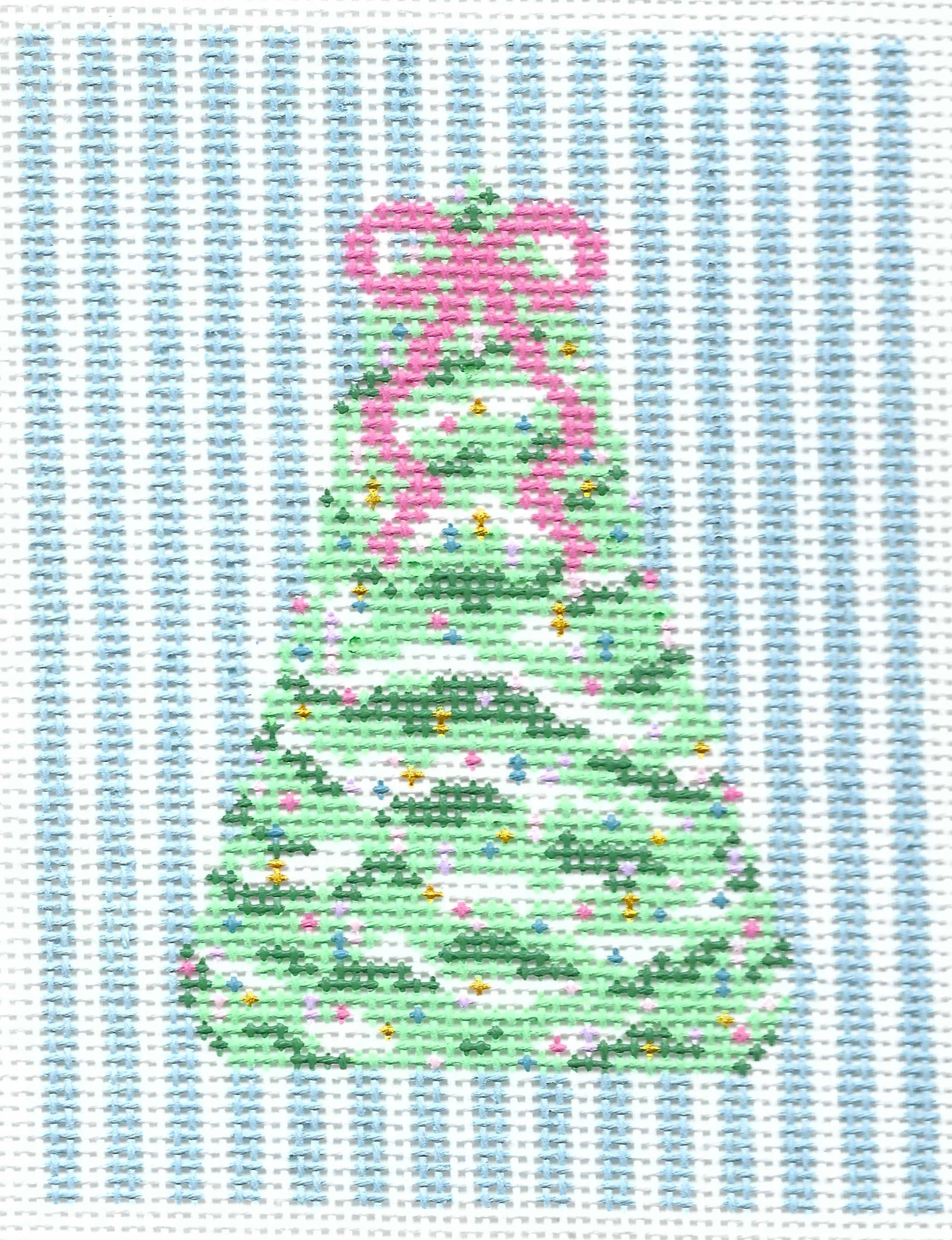 SLS Needlepoint canvas of a green Christmas tree with a pink bow and small colorful ornaments on a background of vertical light blue and white stripes.