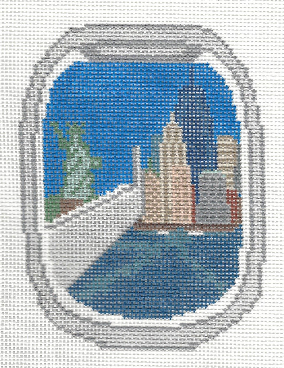 K T G needlepoint canvas of the NYC cityscape with the Statue of Liberty and skyscrapers framed by an airplane window.