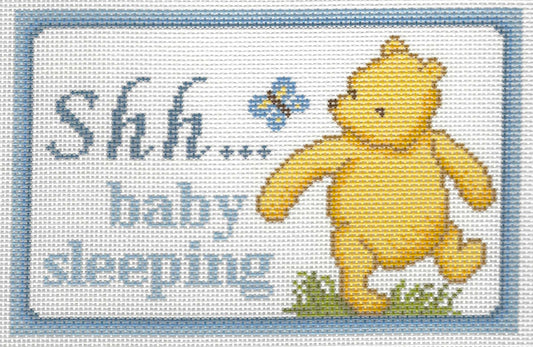 Needlepaint needlepoint canvas of Pooh and a butterfly with 'Shh... baby sleeping' text on a white background with light blue border