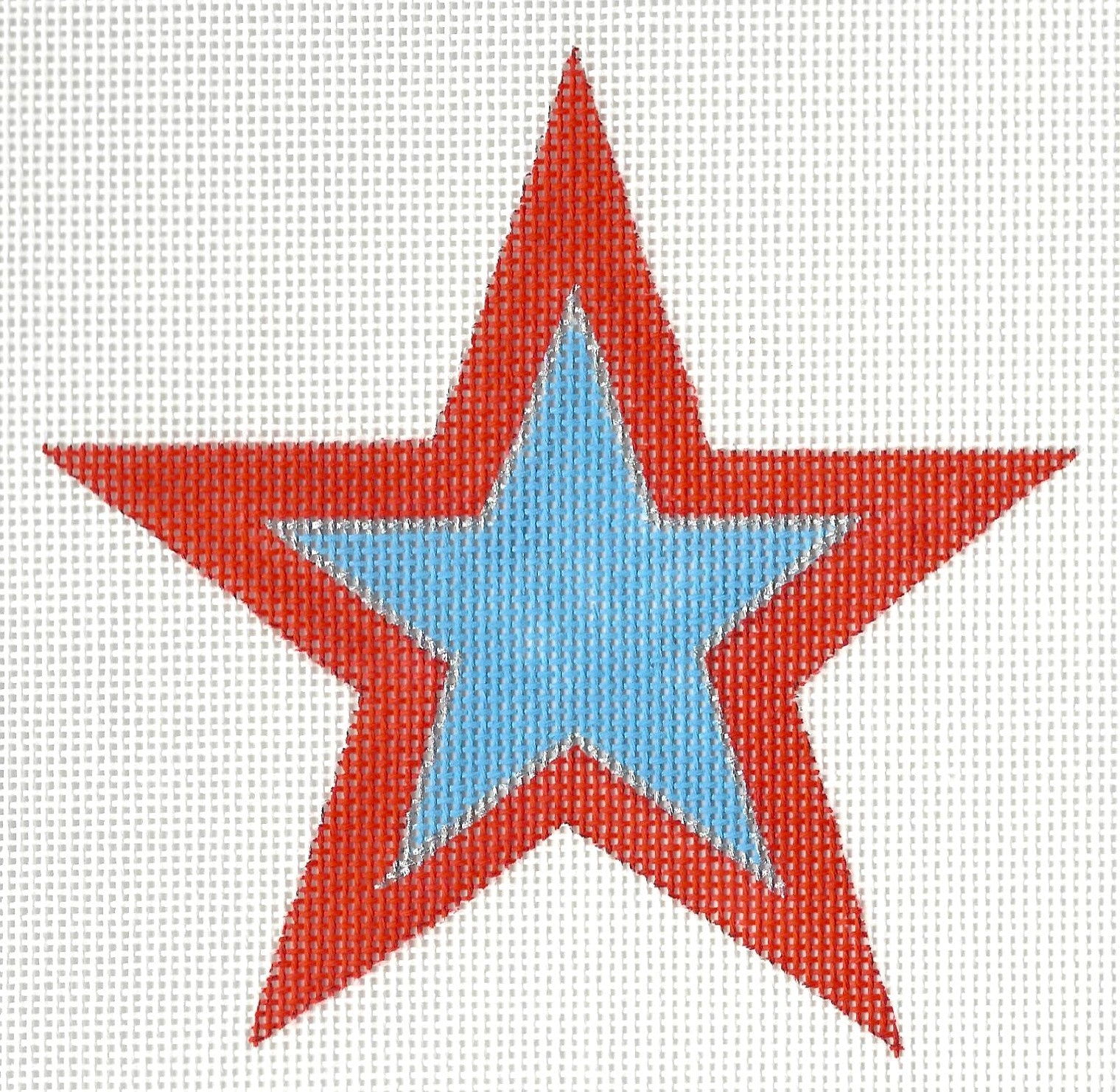 Raymond Crawford Designs needlepoint canvas of red star with a blue center